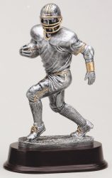 silver and gold gold football trophy